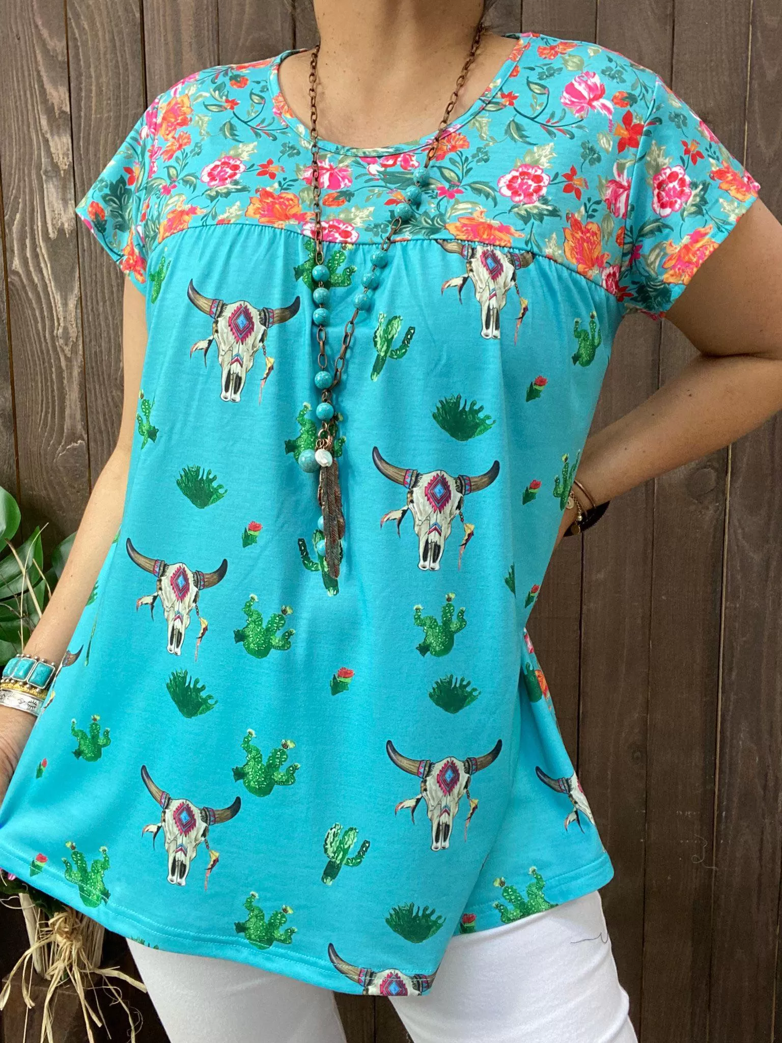 Turquoise steer print top with floral back